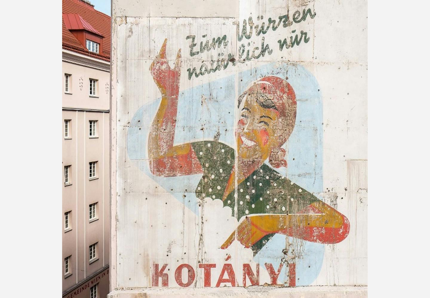The outside of a Viennese building featuring Kotányi advertising.