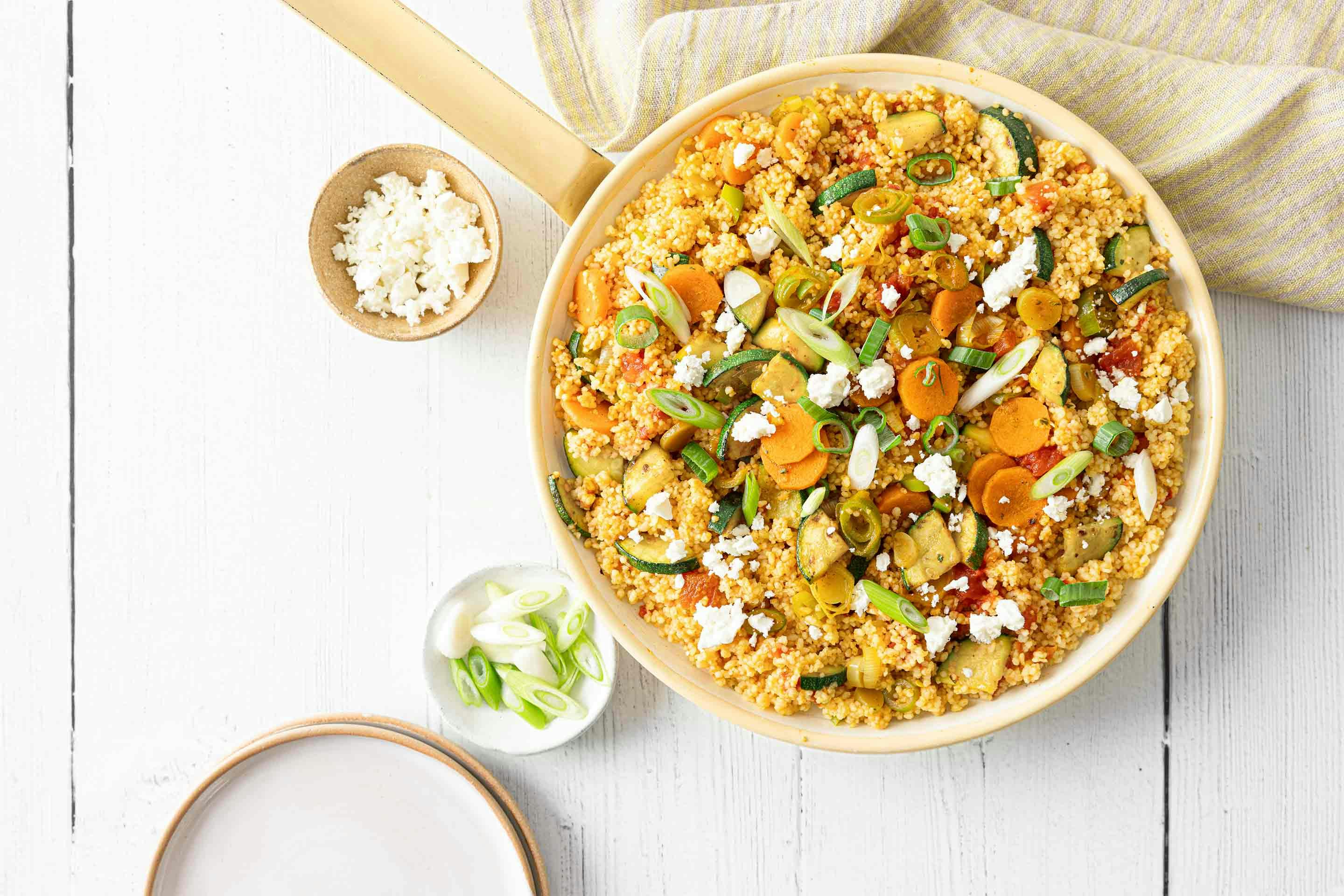 A delicious vegetarian bowl with couscous and mixed vegetables.