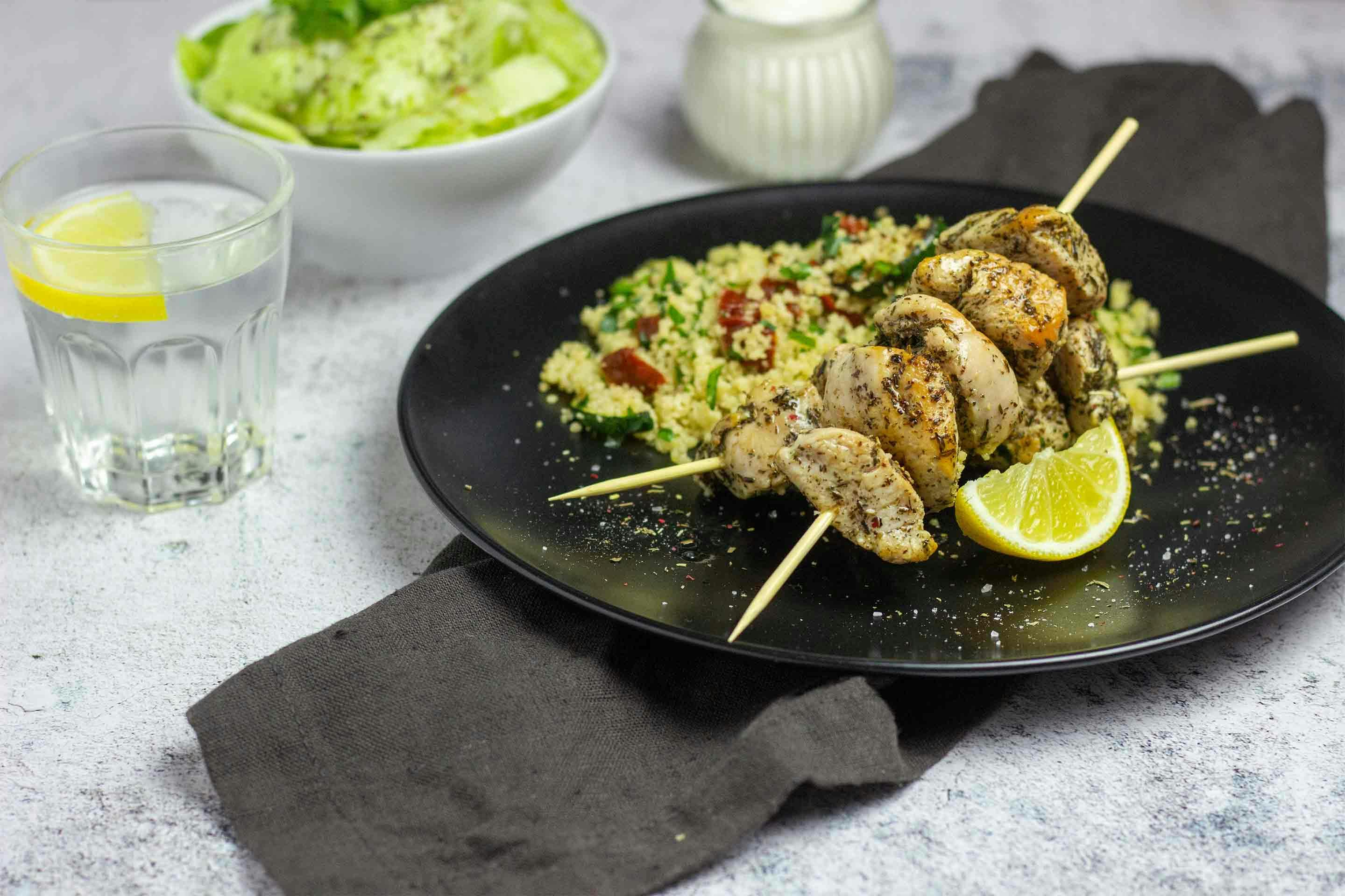 Delicious chicken skewers with Mediterranean couscous bring holiday vibes into the kitchen.