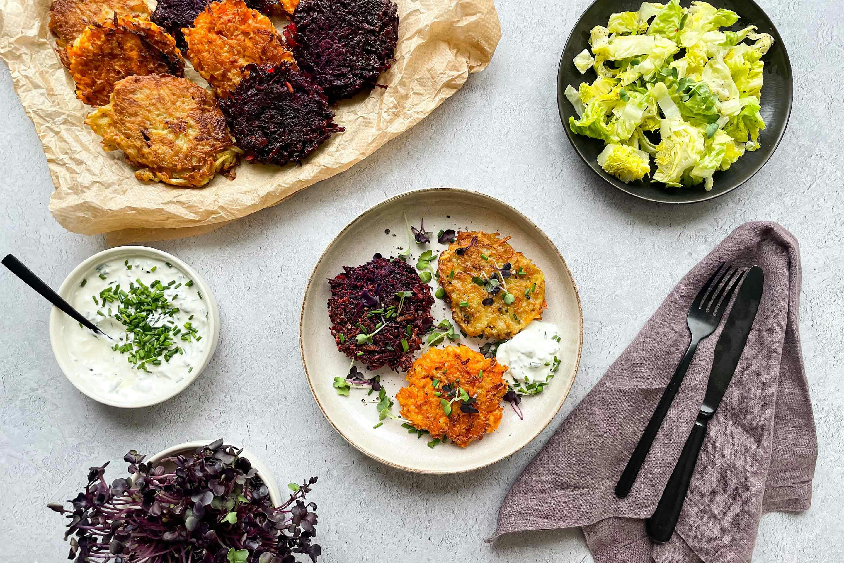 Tasty potato fritters with colorful carrot and beetroot fritters.
