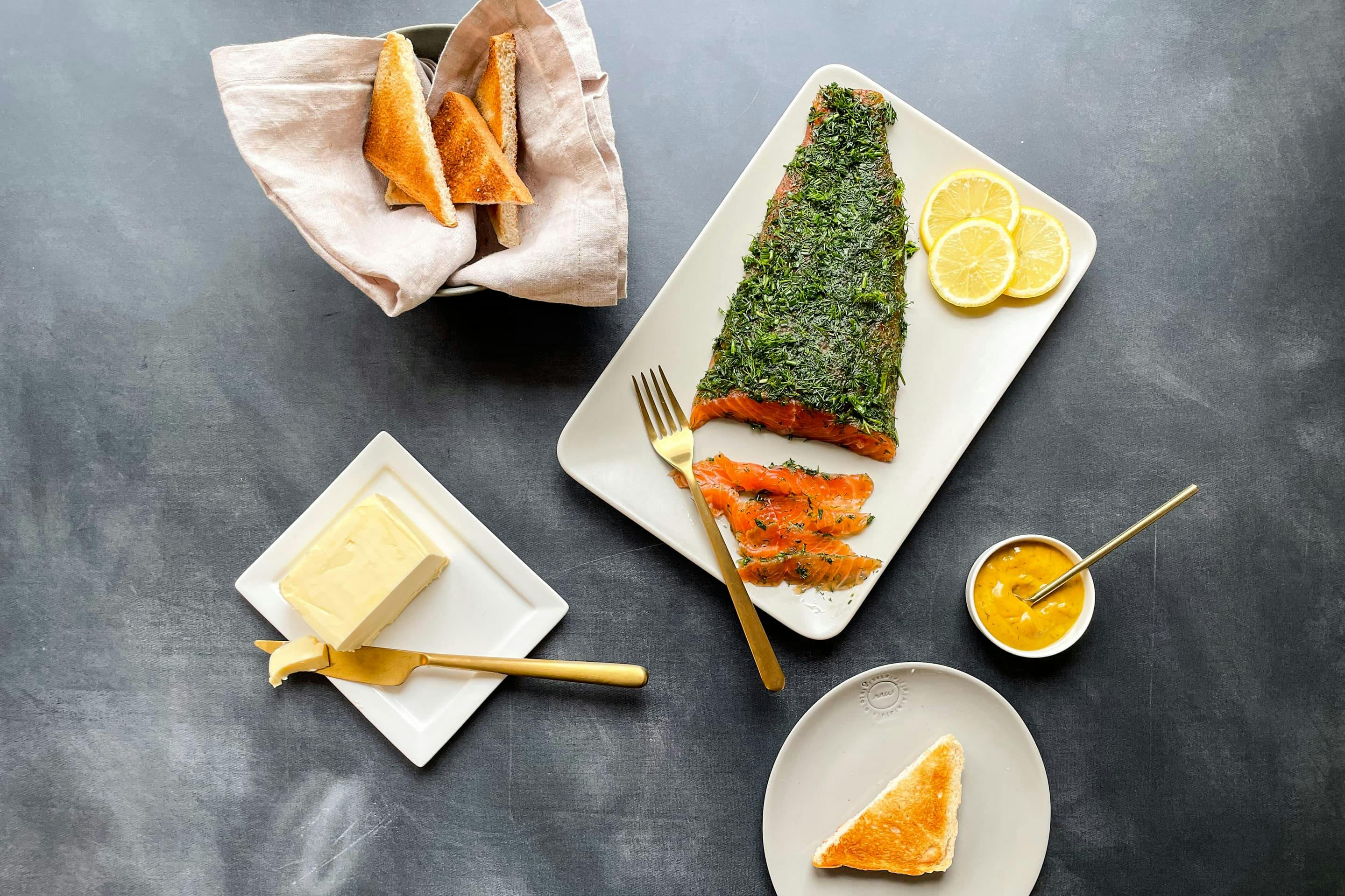 Gin-marinated salmon with an herb crust and toast.