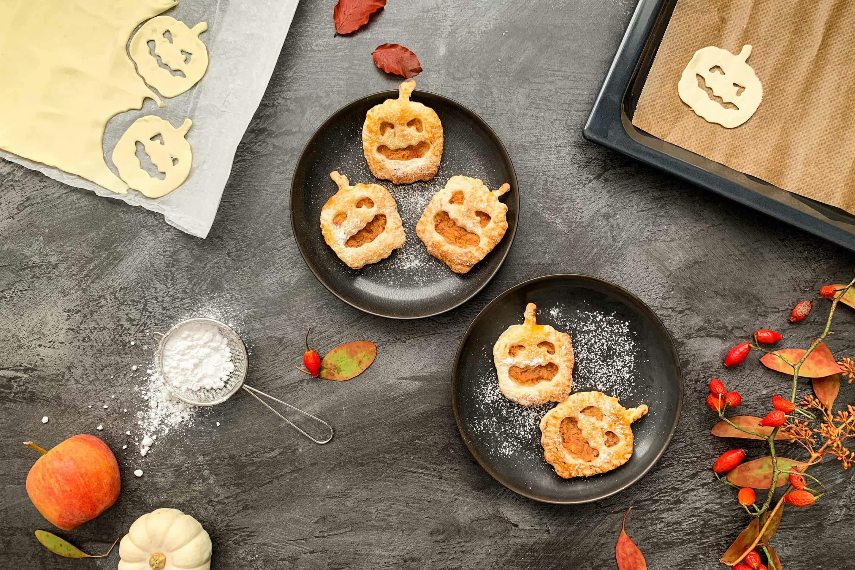 Cute Halloween puff pastry in the shape of jack o'lanterns.