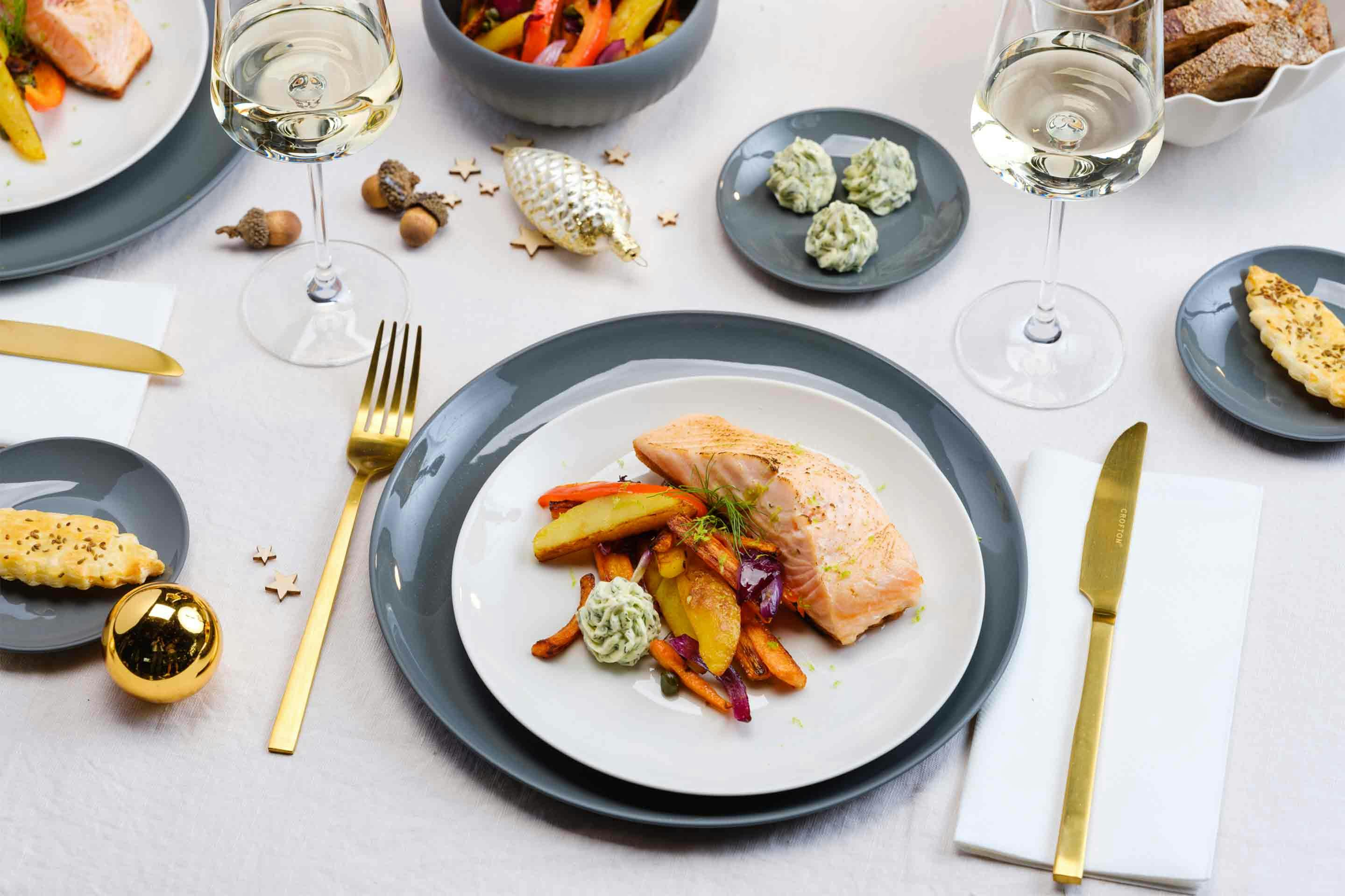 A tender salmon fillet on perfectly oven roasted vegetables.