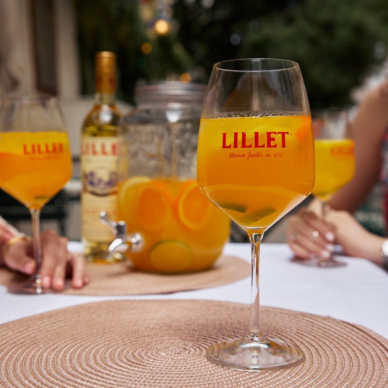 A glass of refreshing Lillet Passion Punch.